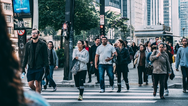 a group of people crossing the street