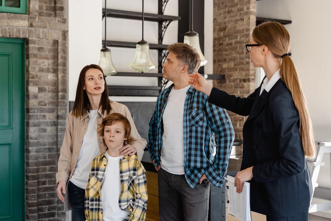one of the home buying etiquette tips is only to bring your closest family members, as this family did