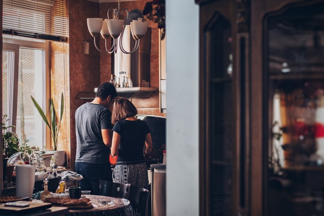 A couple cooking in a kitchen