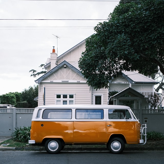 An orange and white van parked outside depicts how to ease the transition into a new house