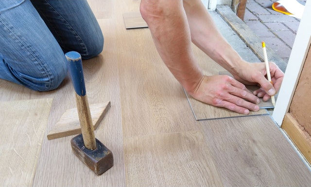 A person installing floors