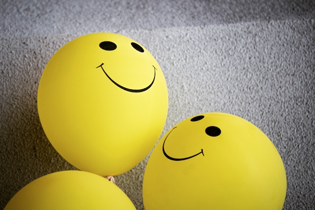 Yellow balloons with smile emojis